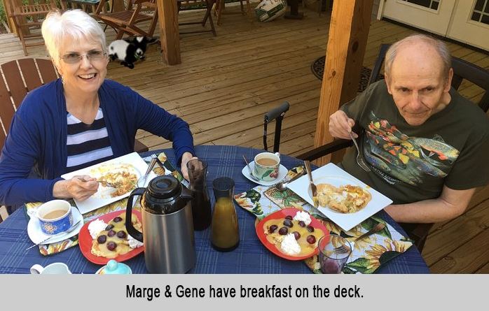 Marge and Gene have breakfast on the deck.